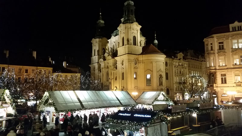 st nicholas church old town with christmas market at night