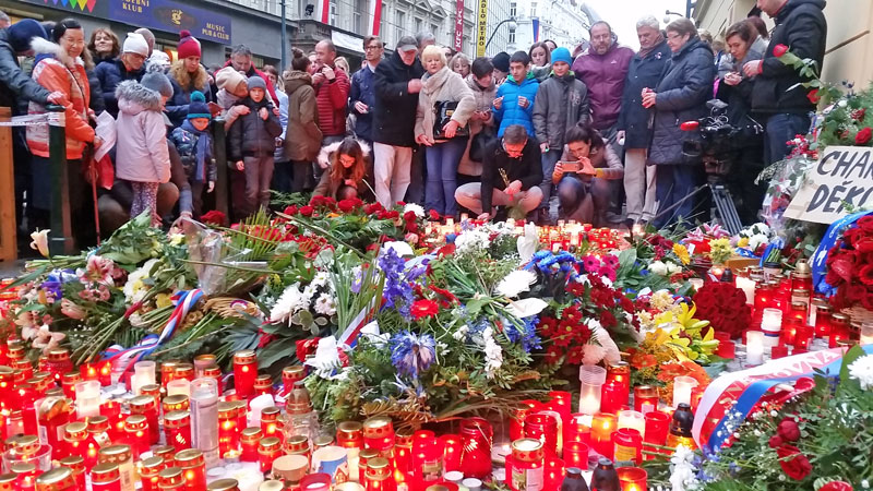 prague velvet revolution memorial with candles and flowers