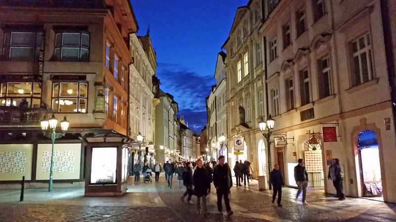 prague celetna street at night with lit shop windows