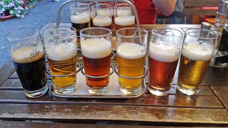 flight of beer on a wooden table