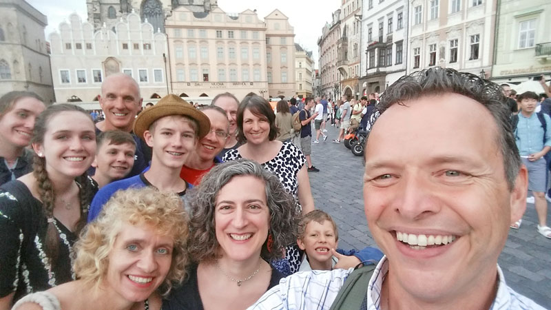 family on prague old town square