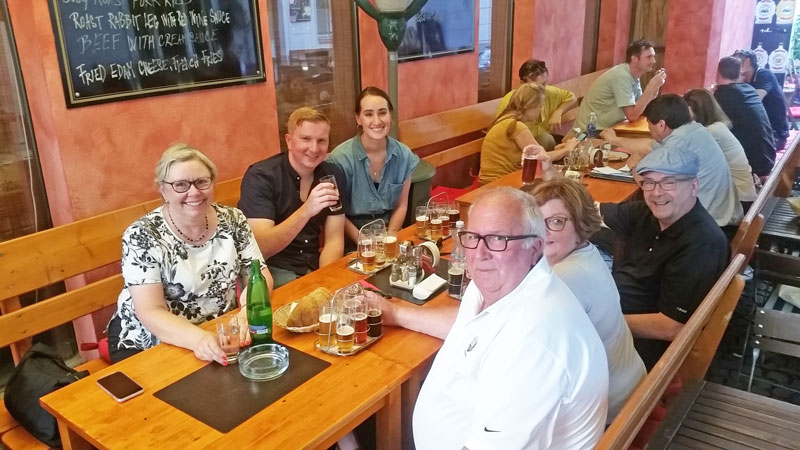 group eating czech food at a prague restaurant